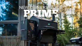 New Owners Guide for Green Mountain Grills Prime model, showcasing the grill in an outdoor setting with trees in the background.