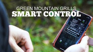 Person using smartphone to control Green Mountain Grills, displaying Smart Control interface with temperature settings and grill status.