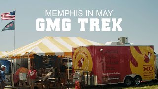 Memphis in May festival scene featuring GMG Trek booth with vibrant yellow and white striped tent, promotional truck, and American flag.