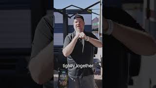 Man demonstrating grilling techniques with a pellet grill, showcasing BBQ skills and tips in an outdoor setting.