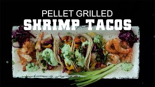Pellet grilled shrimp tacos with vibrant toppings and green onions, showcasing a delicious BBQ dish relevant to Green Mountain Grills recipes.