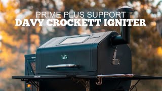 Davy Crockett pellet grill with visible igniter, labeled "Prime Plus Support," showcasing outdoor grilling context.
