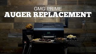 GMG Prime grill with text overlay "Auger Replacement," showcasing grilling food items and a wooden backdrop, related to Green Mountain Grills support videos.